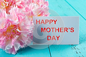 Carnations & card written with happy mothers day the removeable words inside clipping path