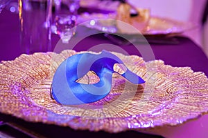 Carnaval table with venetian mask on the plate