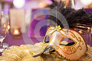 Carnaval table with venetian mask on the plate photo