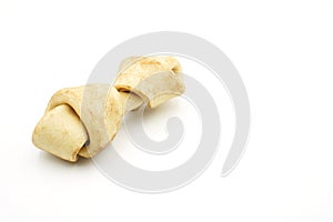 Carnaza bone for dogs to bite on, on a white background