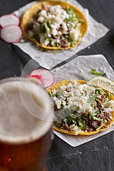 Carne asada beef tacos with queso fresco and beer photo