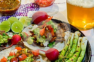 Carne asada tacos with craft beer in Tijuana with copy space