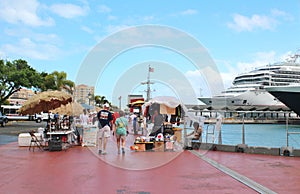 Carnival Conquest cruise ship and passengers - March 9, 2017 - cruise ships passengers returning to their ship docked in San Juan,