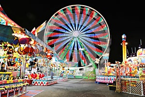 Carnival and Ferris Wheel at Night - Bright Lights and Long Exposure