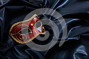 Carnival mask isolated on black satin background