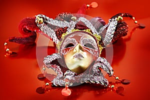 Carnival mask on red background