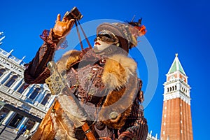 Carnival mask on San Marco square in Venice, Italy