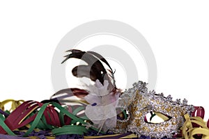 Carnival Mask and Streamers agains white background. Festive concept