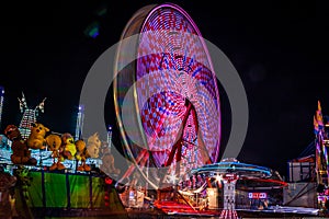 Carnival at night - rides in motion patterned lights