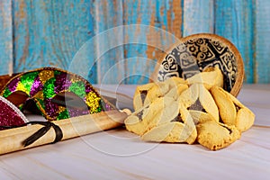 Carnival with noisemaker Hamantaschen cookies Purim jewish holiday