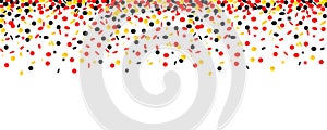 Carnival and party confetti in black yellow and red colors isolated on a white background