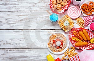 Carnival theme food side border over a white wood background