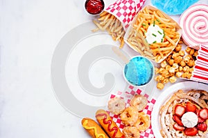 Carnival theme food side border on a white marble background