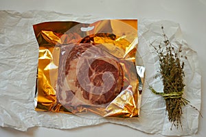 Carnivore, meat diet conceptual image with rib eye steak ready to be cooked on a white background