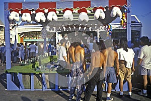 Carny game on Santa Monica pier with tourists