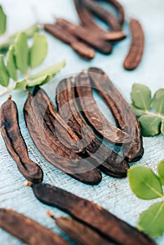 Carob on wooden table