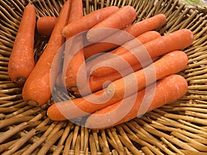 Carots orange color in basket.