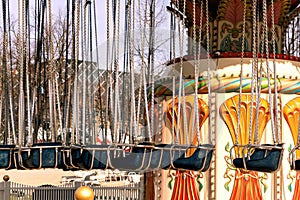 Carousel in an amusement park on a sunny day.