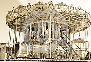 Carousel, carrousel, roundabout, nostalig merry-go-round, sepia color