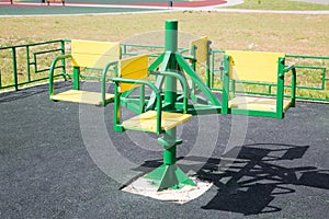 Carousel children`s metal green on the Playground with rubberized coating.