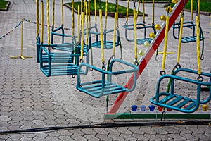 Carousel children`s seats run fast at amusement park