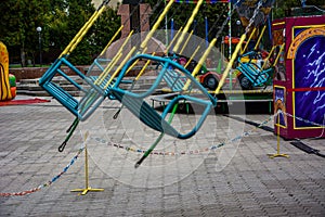 Carousel children`s seats run fast at amusement park