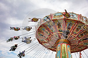 Carousel on cloudy sky background. Oktoberfest, Bavaria, Germany