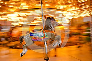 Carousel horse panning photo