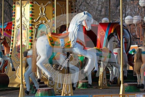 Carousel with horses in City Park in morning sun