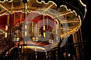Carousel merry-go-round with light at night