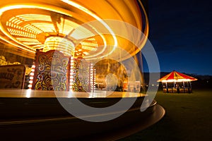 Fairground carousel at night photo