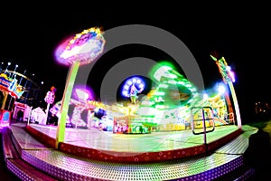 Carousel night in motion. Blur and motion effects