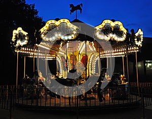 Carousel in night park. Night entertainment