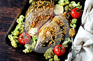 Carp before baking with vegetables: broccoli, tomatoes