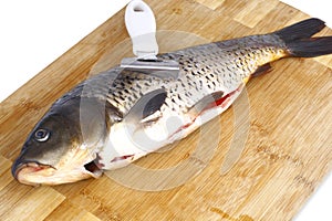 Carp and a knife for cleaning fish