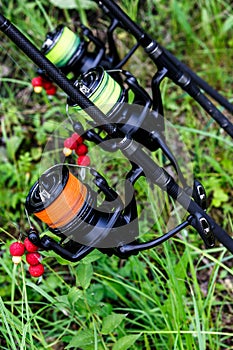 Carp spinning reel angling rods on pod standing. Carp Rods,Carpfishing session at the Lake.Professional fishing equipment