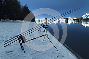 Carp spinning reel angling rods in winter night. Night Fishing