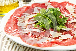 Carpaccio of beef on arugula