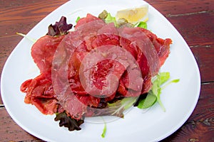 Carpaccio: italian dish of slices of raw beef