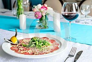 Carpaccio on the table in the restaurant photo