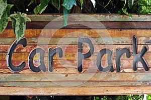 Carpark sign on wood