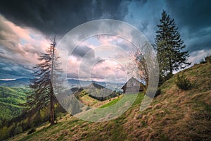 Carpathian landscape with abandoned house on a hill