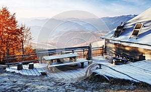 Carpathian mountain landscape with wooden farmhouse. October mou