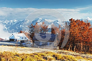 Carpathian mountain landscape with wooden farmhouse. October mou