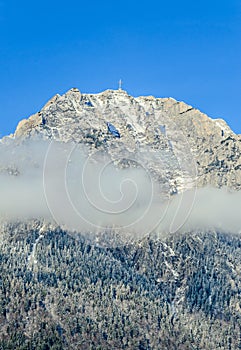Carpathian mountains, Bucegi with Cross in top of Caraiman Peak