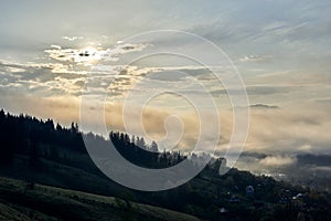 Carpathian mountains at dawn. Panoramic view of beautiful sunrise in ukrainian countryside in summer. Natural landscape, rural