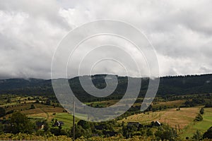 Carpathian mountains, meadows and mountain houses, gardens and the sky