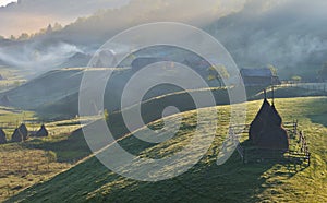 Carpathian rural landscape with a haystack