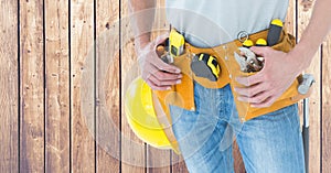 Carpenter against wood panel