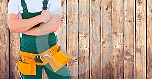 Carpenter against wood panel